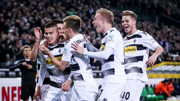 Laszlo Benes (L) of Gladbach celebrates with his team-mates after he scores the opening goal