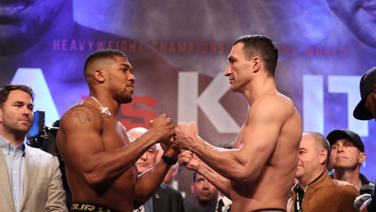 Anthony Joshua and Wladimir Klitschko pose at the weigh-in before their heavyweight title fight.