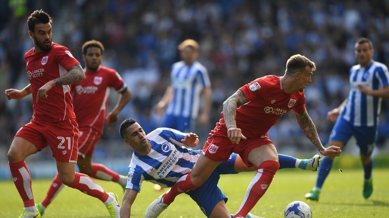 Aden Flint of Bristol City evades Tomer Hemed of Brighton and Hove Albion during the Sky Bet Championship match between Brig