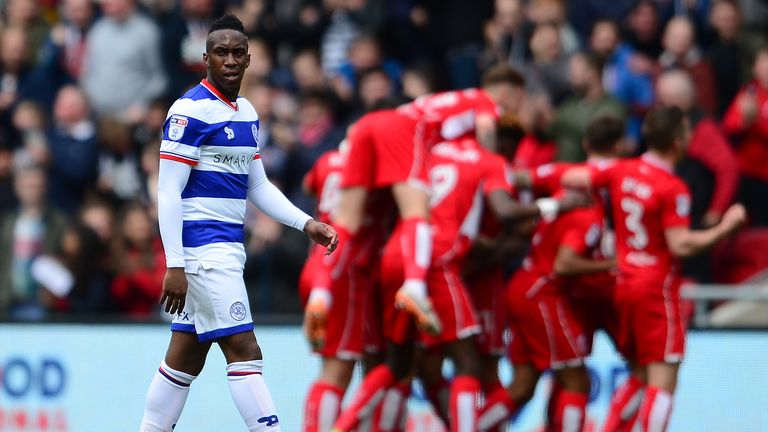 Yeni Atito Ngbakoto of Queens Park Rangers looks on as Marlon Pack of Bristol City (behind) celebrates