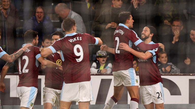 BURNLEY, ENGLAND - APRIL 04: George Boyd of Burnley (R) celebrates scoring his sides first goal with his Burnley team mates during the Premier League match