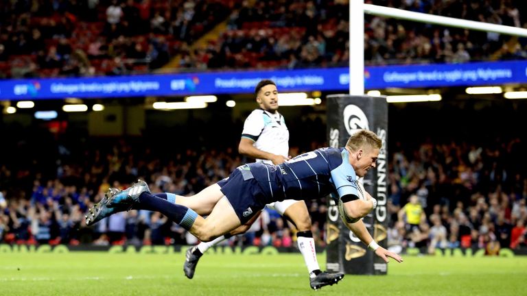 Gareth Anscombe dives over for a try for the Blues