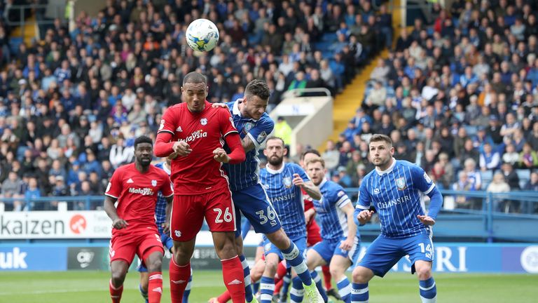 Kenneth Zohore and Daniel Pudil contest a header at at Hillsborough