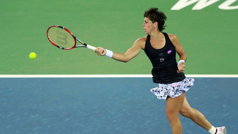 WUHAN, CHINA - SEPTEMBER 28:  Carla Suarez Navarro of Spain returns a shot to Johanna Konta of Great Britain during their Fourth round match on Day 4 of th