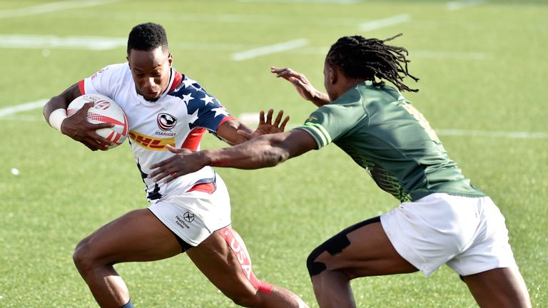  Carlin Isles (L) of the United States holds offs Seabelo Senatla of South Africa during the USA Sevens Rugby 