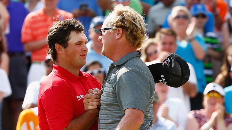 SAN ANTONIO, TX - APRIL 24:  Charley Hoffman celebrates with Patrick Reed after putting in on the 18th hole during the final round of the Valero Texas Open