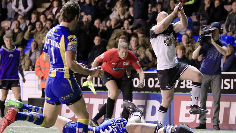 Charly Runciman scores a try against Warrington