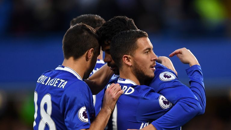 LONDON, ENGLAND - APRIL 25:  Eden Hazard of Chelsea (10) celebrates as he scores their first goal with team mates during the Premier League match between C