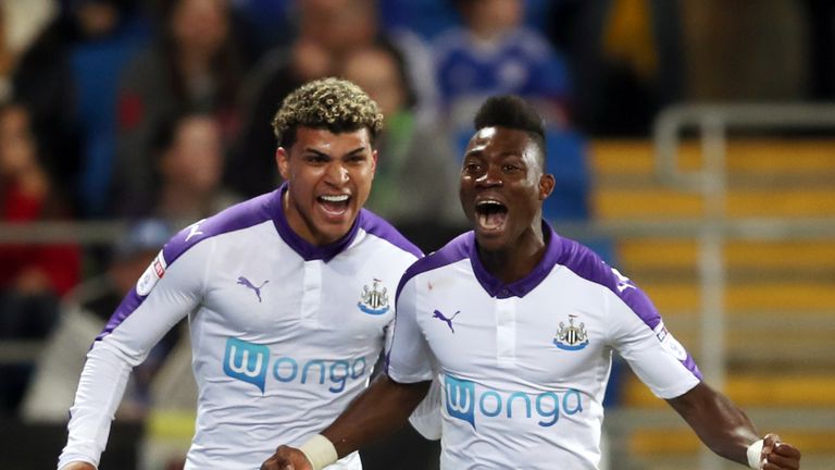 Christian Atsu (right) celebrates scoring Newcastle's first goal at Cardiff
