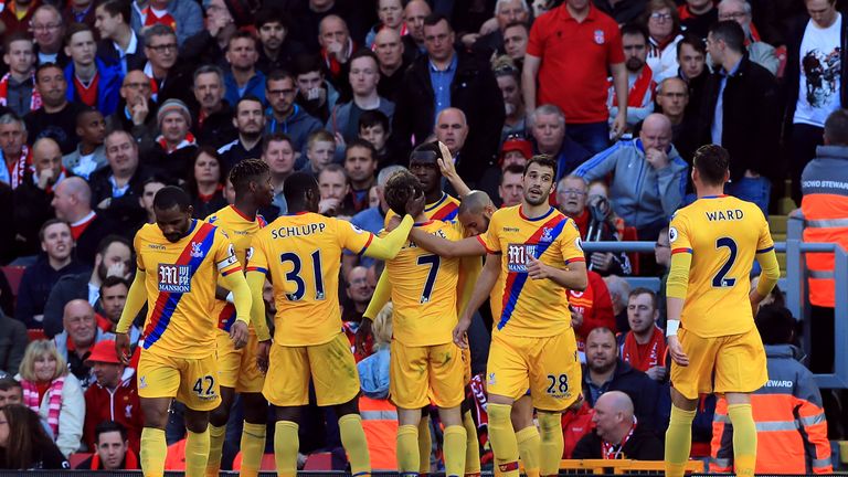 Crystal Palace's Christian Benteke celebrates scoring his side's first goal of the game with his team-mates during the Premier League match at Anfield, Liv