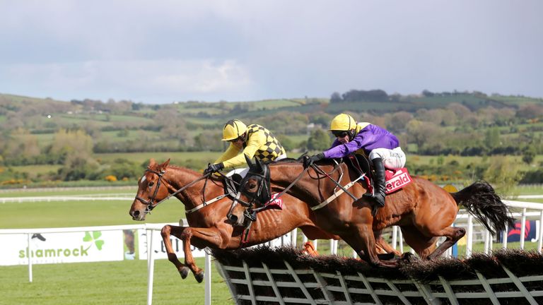 Jockey David Mullins on board Cilaos Emery (right) wins the  Herald Champion Novice Hurdle 