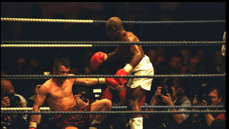 BABY JAKE MATLALA STANDS OVER THE FALLEN PAT CLINTON. PAT CLINTON WON THE FIGHT.