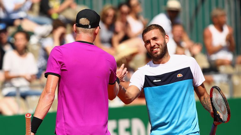 Dan Evans of Great Britain shakes hands at the net after his straight sets defeat by Kyle Edmund of Great Britain in their