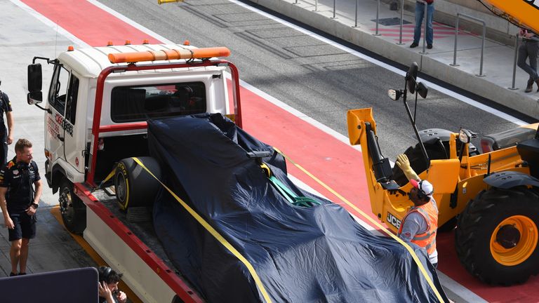 The car of Daniel Ricciardo (AUS) Red Bull Racing RB13 is recovered to the pits at Formula One Testing, Day One, Bahrain International Circuit