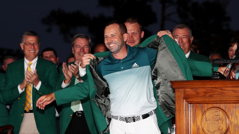 AUGUSTA, GA - APRIL 09:  Danny Willett of England presents Sergio Garcia of Spain with the green jacket after Garcia won in a playoff during the final roun