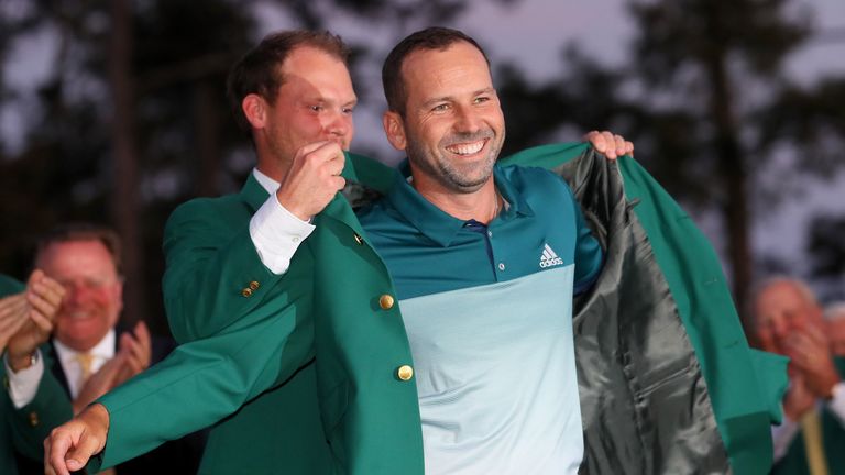 AUGUSTA, GA - APRIL 09:  Danny Willett of England presents Sergio Garcia of Spain with the green jacket after Garcia won in a playoff during the final roun