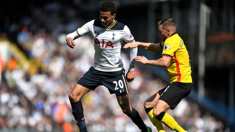 LONDON, ENGLAND - APRIL 08: Dele Alli of Tottenham Hotspur (L) and Tom Cleverley of Watford (R) battle for possession during the Premier League match betwe