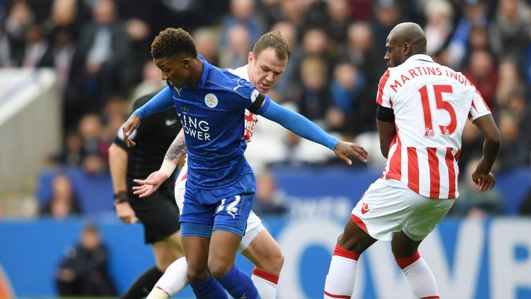 Demarai Gray of Leicester City (L) attempts to get away from Bruno Martins Indi of Stoke City (R) during the Premier League 