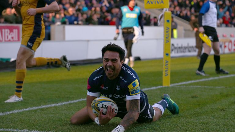 SALFORD, ENGLAND - JANUARY 1: Denny Solomona of Sale Sharks scores a try during the Aviva Premiership match between Sale Sharks and Bristol Rugby at AJ Bel