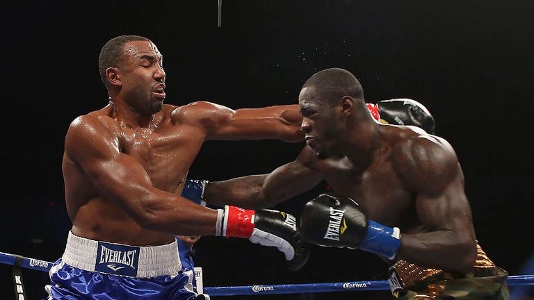 Deontay Wilder (R) lands a right hand to the body of Kelvin Price during their Vacant WBC Continental Americas Heavyweight title 
