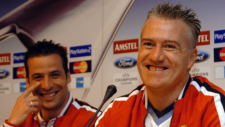 MADRID, Spain:  Monaco's French coach Didier Deschamps (R) and French forward Ludovic Giuly smile during a press conference on the eve of their Champions l