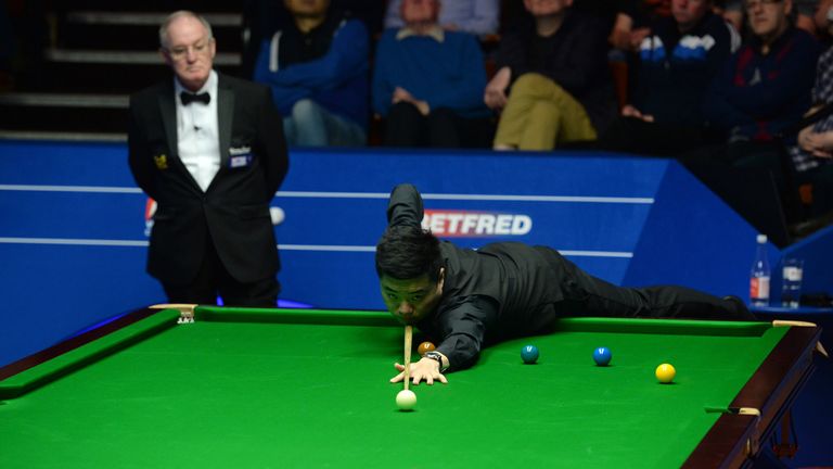 Ding Junhui at the table in his match against Zhou Yuelong on day four of the Betfred Snooker World Championships at the Crucible Theatre, Sheffield.