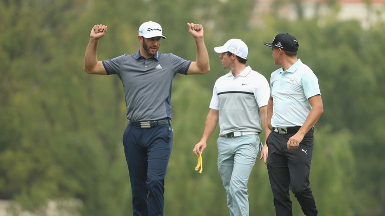 SHANGHAI, CHINA - NOVEMBER 05:  Dustin Johnson of the USA (left) gestures as Rory McIlroy of Northern Ireland (centre) and Rickie Fowler (right) look on du