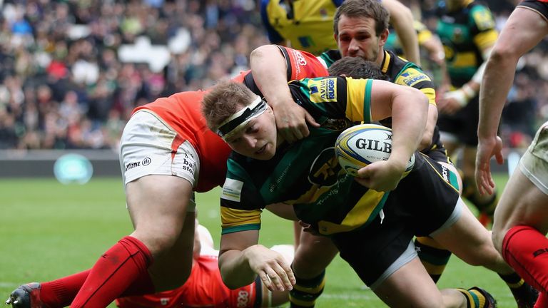 APRIL 16 2017: Dylan Hartley of Northampton dives over for a try despite being held by Jamie George of Saracens
