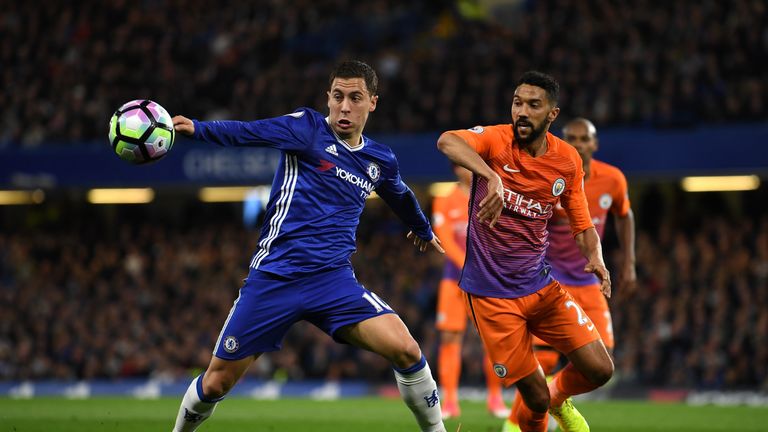 Eden Hazard of Chelsea (L) and Gael Clichy of Manchester City (R) battle for possession during the Premier League match