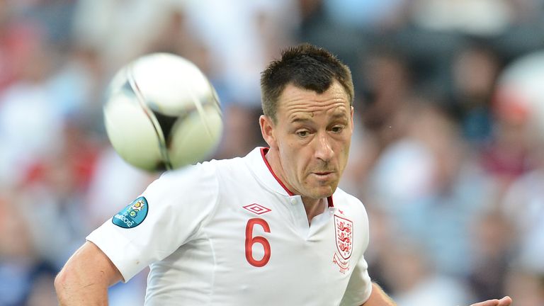 (FILES) In this photo taken on June 11, 2012 English defender John Terry kicks the ball during the Euro 2012 championships football match France vs England