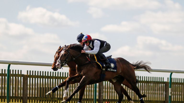 Frankie riding Escobar (R) gallop before racing at Newmarket on Wednesday