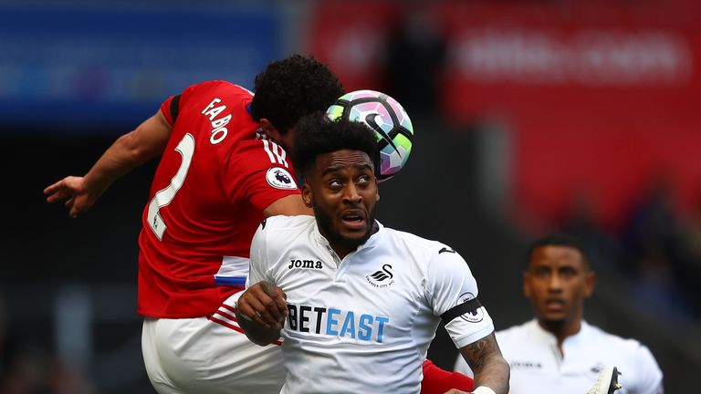 SWANSEA, WALES - APRIL 02:  Fabio Da Silva of Middlesbrough (L) and Leroy Fer of Swansea City (R) battle to win a header during the Premier League match be