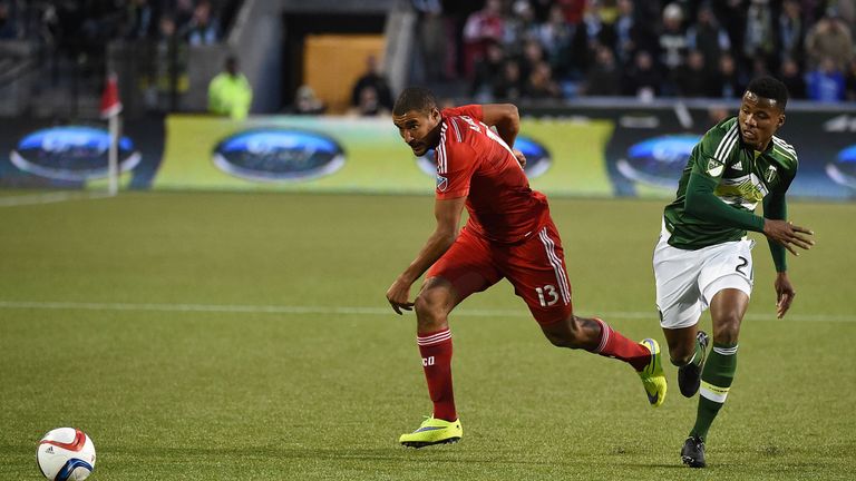 PORTLAND, OR - APRIL 04: Tesho Akindele #13 of FC Dallas brings the ball up the field on Alvas Powell #2 of Portland Timbers during the first half of the g