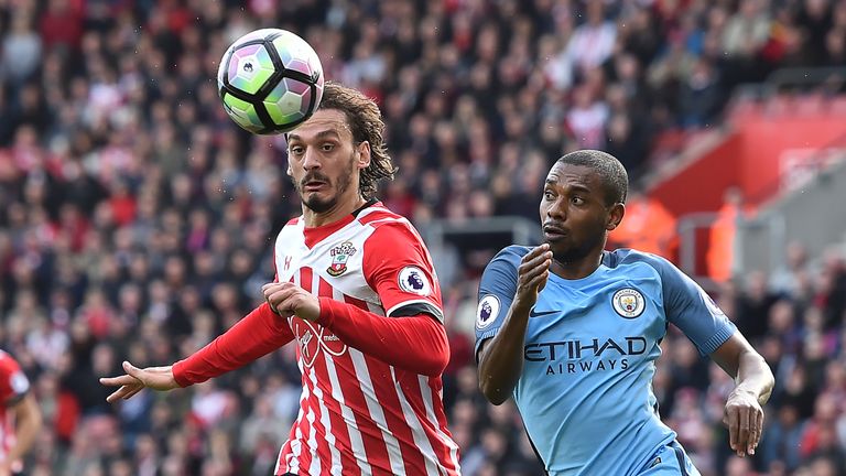 Manolo Gabbiadini and Fernandinho battle for possession at St Mary's