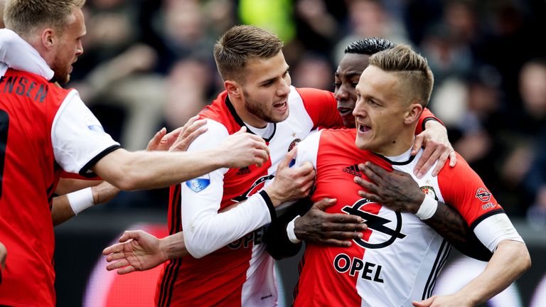 Feyenoord Rotterdam's Dutch midfielder Jens Toornstra (R) celebrates with teammates Dutch defender Bart Nieuwkoop (2nd L) and Dutch midfielder Eljero Elia 