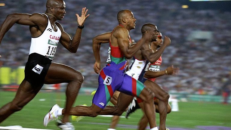 Donovan Bailey of Canada, left, on his way to defeating Frankie Fredericks, blue uniform, for the gold medal in the men's 100m final, Atlanta Olympics 1996