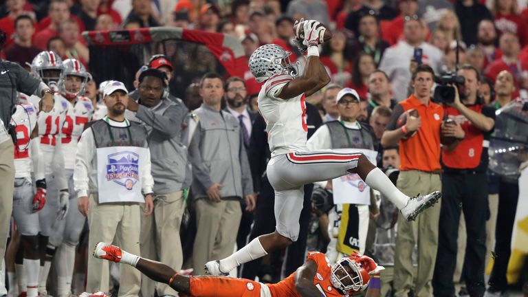 GLENDALE, AZ - DECEMBER 31:  Gareon Conley #8 of the Ohio State Buckeyes intercepts a pass intended for Mike Williams #7 of the Clemson Tigers during the f