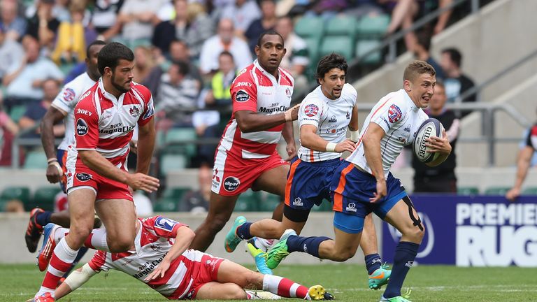 Gareth Stoppani of New York breaks with the ball to score a try against Gloucester  in the Plate final during the World Club 7s