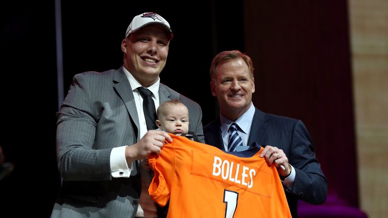PHILADELPHIA, PA - APRIL 27:  (L-R) Garett Bolles of Utah and his son Kingston pose with Commissioner of the National Football League Roger Goodell after b