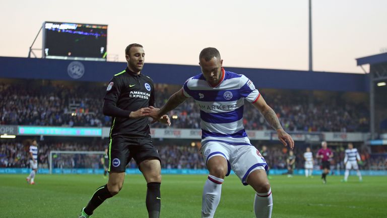 Brighton & Hove Albion's Glenn Murray (left) and Queens Park Rangers' Joel Lynch battle for the ball during the Sky Bet Championship match at Loftus Road, 