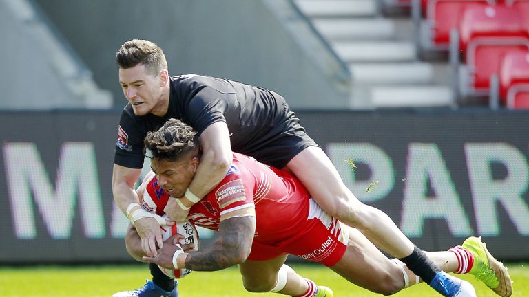 Greg Johnson scores for Salford under pressure from Toronto's Blake Wallace