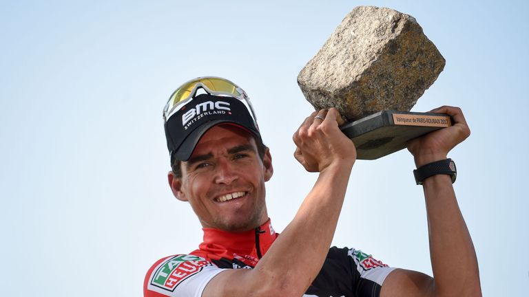 Belgium's Greg Van Avermaet holds his trophy as he celebrates on the podium after winning the 115th edition of the Paris-Roubaix one-day classic cycling ra