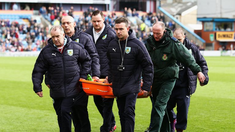 BURNLEY, ENGLAND - APRIL 01:  Harry Winks of Tottenham Hotspur is taken off injured on a stretcher during the Premier League match between Burnley and Tott