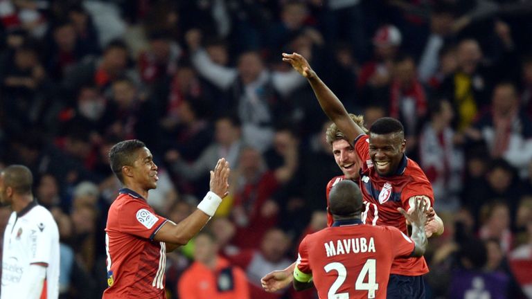 Lille's French midfielder Ibrahim Amadou  (R) celebrates with teammates after scoring a goal  during the French L1 football match between Lille (LOSC) and 