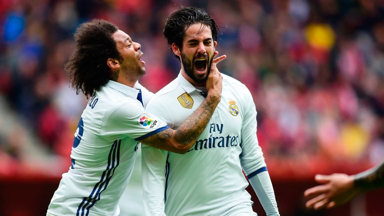 Isco celebrates his winning goal with team-mate Marcelo