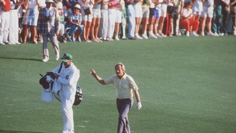 Apr 1986:  Jack Nicklaus signals to the galery as he walks up the 18th fairway with his caddy and son Jack Nicklaus Jr. following his approach shot to the 