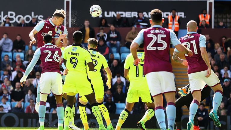 BIRMINGHAM, ENGLAND - APRIL 15:  James Chester of Aston Villa heads the ball to score a goal during the Sky Bet Championship match between Aston Villa and 