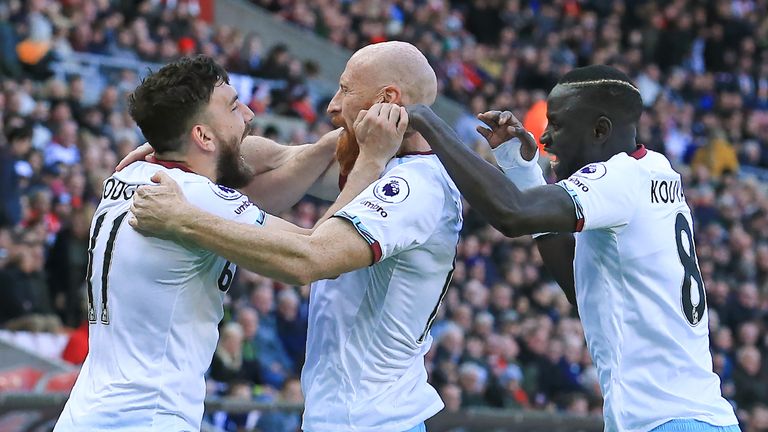 James Collins celebrates his goal with Robert Snodgrass and Cheikhou Kouyate