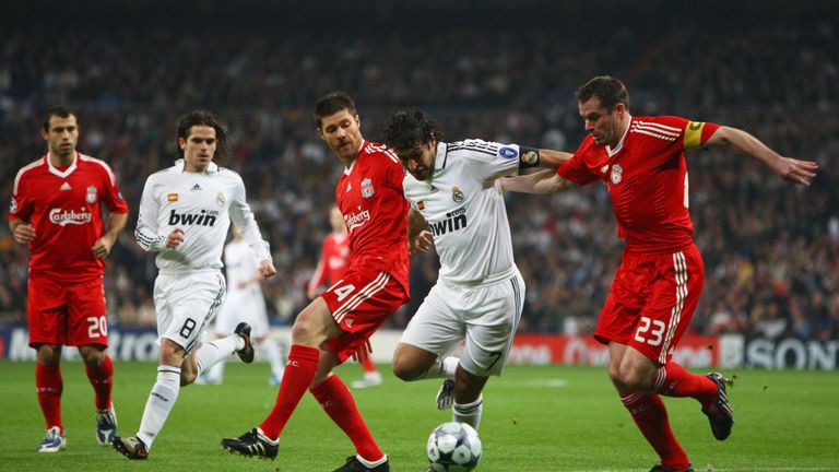 MADRID, SPAIN - FEBRUARY 25:  Raul of Real Madrid goes between Jamie Carragher and Xabi Alonso of Liverpoolduring the Champions League Round of 16, First L