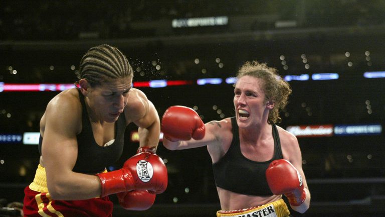 Jane Couch (right) hits Lucia Rijker during their women's light welterweight bout at the Staples Center on June 21, 2003 in Los Angeles